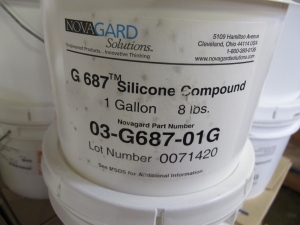 (214 1 GALLON CONTAINERS) NOVAGARD SOLUTIONS G 687, SILICONE COMPOUND. LOADING & HANDLING FEE $15-4101